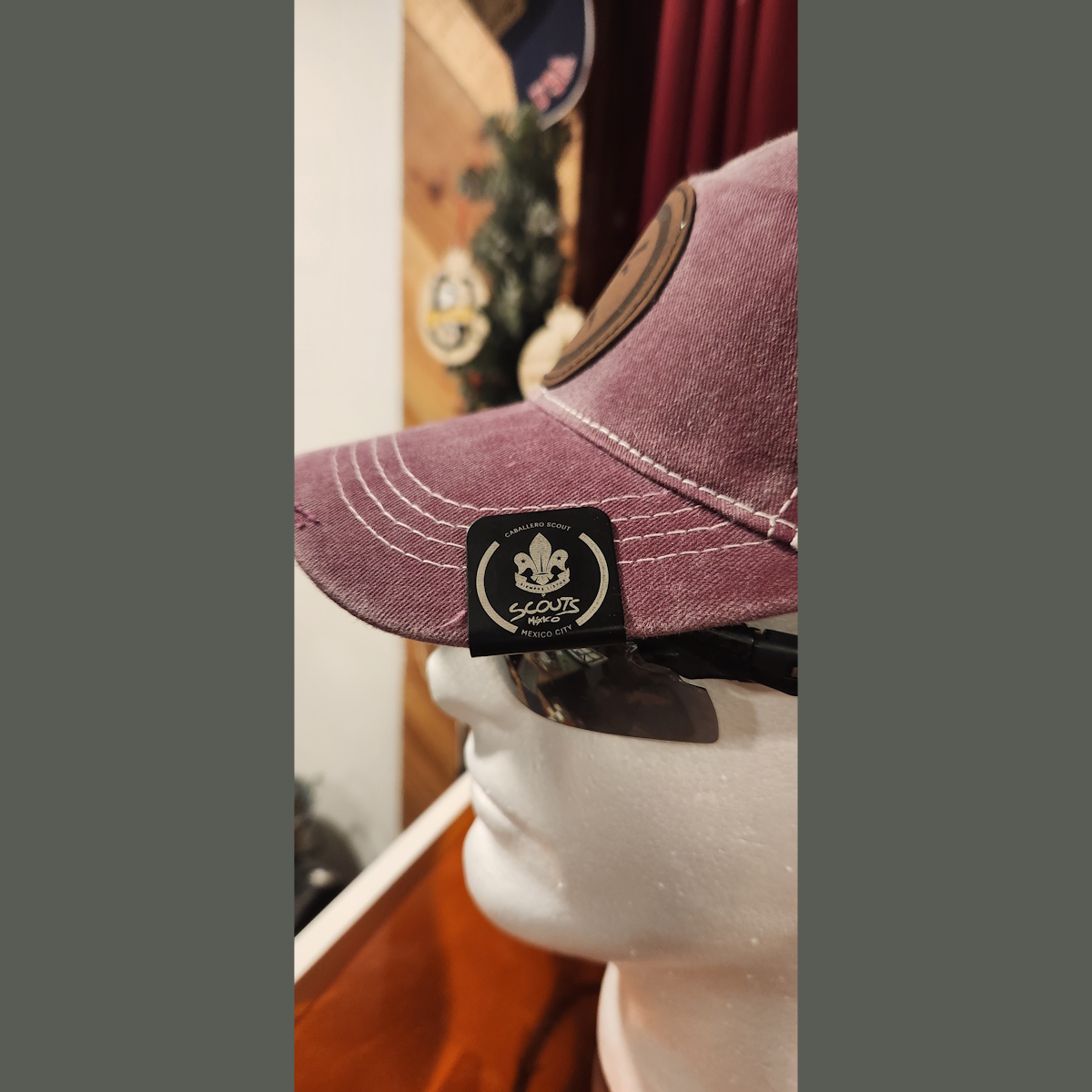 Custom anodized aluminum hat clip — Cabelleros Scout design